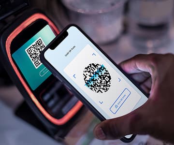 Person making a cashless payment using smartphone